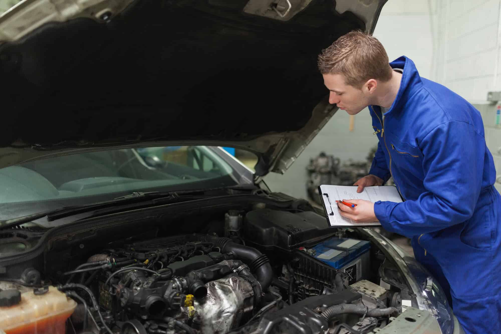 Mechanic inspecting the car